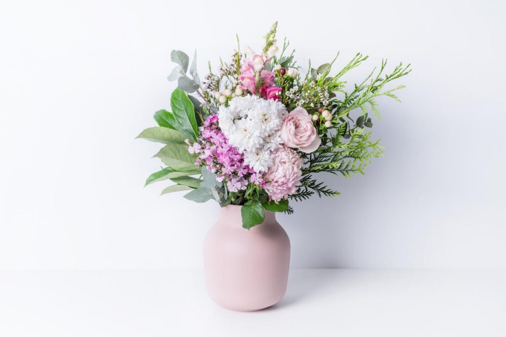 Beautiful cottage style flower arrangement, in a pink vase